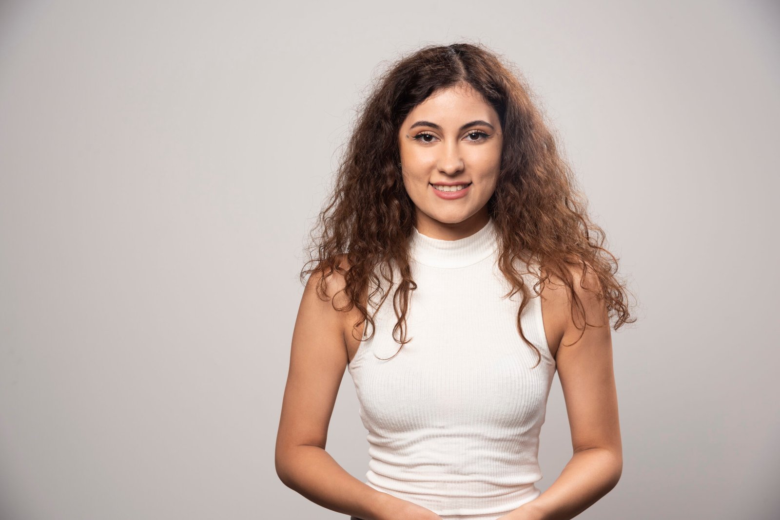 young woman white blouse standing white wall high quality photo scaled